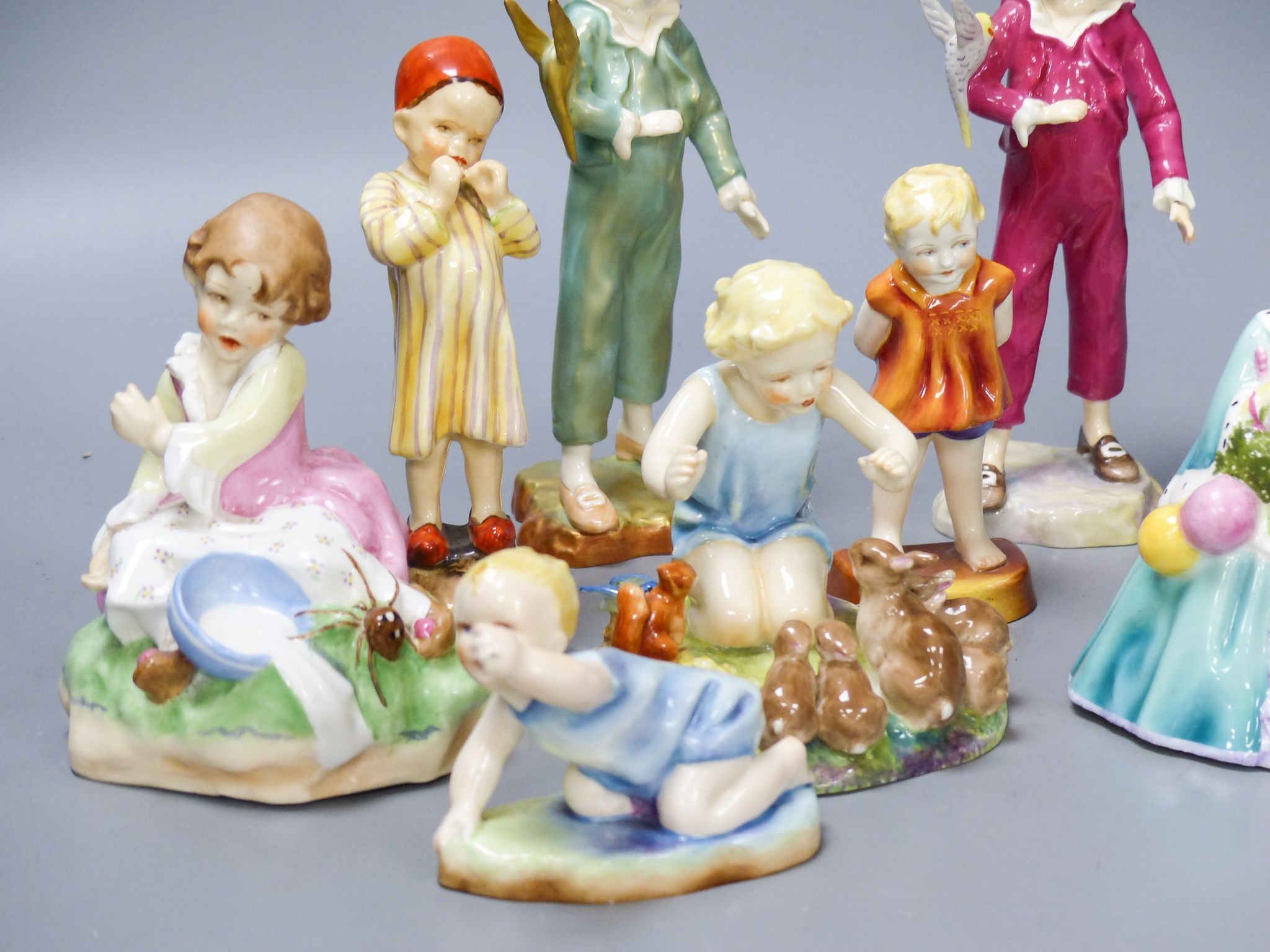 Three Worcester F.G. Doughty figures of children, 4 others and 2 figurines (9)